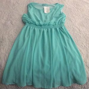 Knee length teal colored dress